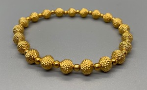 lot 101 image: Brilliant Brass Beaded Stretch Bracelet