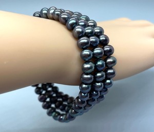 lot 102 image: Triple Strand Dyed Freshwater Pearl Stretch Bracelet