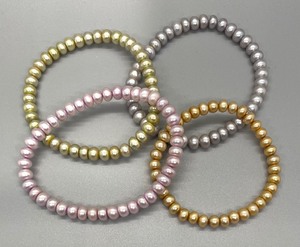 lot 131 image: Four Dyed Freshwater Pearl Stretch Bracelets