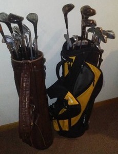 lot 11 image: (2) Sets of Gold Clubs And Bags  Wilson