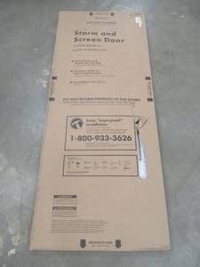 lot 435 image: EMCO 30 in. x 80 in. 100 Series White Self-Storing Storm Door