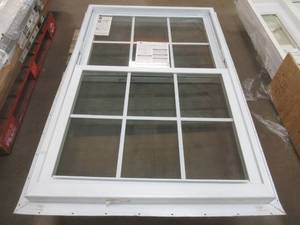 lot 440 image: American Craftsman 37.75 in. x 56.75 in. 70 Series Low-E2 Argon PS Glass Double Hung White Vinyl Fin with J Window with Grids, Screen Incl (TOP PANE IS BROKEN, SEE PHOTOS)