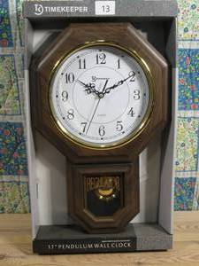 lot 13 image: Timekeeper Essex Faux Wood Traditional Schoolhouse Pendulum Wall Clock for Home and Office, Westminster Chime, 17.5 x 11.25, Walnut