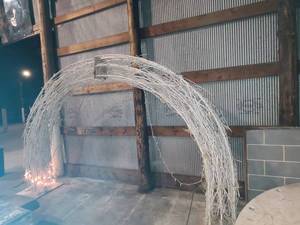 lot 17 image: White Branch and lighted archway made of metal 2 pieces roughly 7 x 8