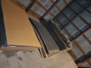 lot 101 image: 3 stacks of peg board 8 x 4 sheets