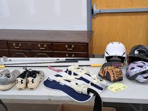 lot 453 image: Lot of  Sport Equipment - Golf Clubs, Helmets, Bike Helmet, Baseball Glove, Nike Size 14 Cleats, Under Armour Cleats, Leg Brace