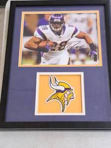 lot 492 image: Adrian Peterson #28 Minnesota Vikings Photo with Patch , FramedSingle MattePlexiglass Glass