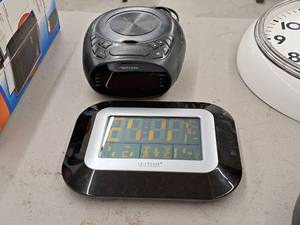 lot 143 image: (1) Memorex Clock Radio, (1) La Crosse Technology Weather Clock