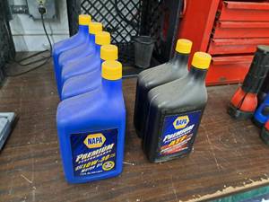 lot 180 image: Lot of (7) Automotive Fluids - NAPA 10W-30 Motor Oil 1-Qt (x5), NAPA ATF 1-Qt (x2)