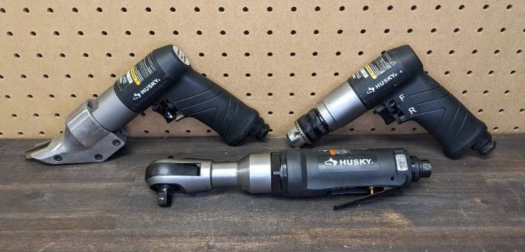 lot 124 image: Husky Air Tool Lot, Including an Air Shear, a 38 in. Keyed Chuck Reversible Drill, and a 50 ft.lbs. 38 in. Ratchet Wrench