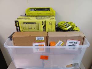 lot 198 image: Large Bin of Milwaukee, RYOBI, and RIDGID Power Tool Batteries and Battery Chargers
