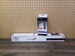 lot 115 image: Set of Delta Porter Collection 24 in. Towel Bar and Toilet Paper Holder