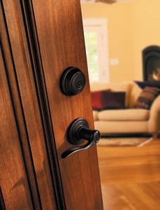lot 60 image: Kwikset Lido Venetian Bronze Exterior Entry Door Handle and Single Cylinder Deadbolt Combo Pack Featuring SmartKey Security