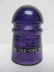 lot 110 image: Antique CD 102 Deep Royal Purple Glass Pony Insulator