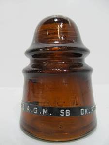 lot 210 image: Antique A.G.M. CD 423 Dark Red Amber Glass Insulator
