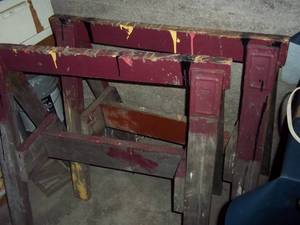 Room filled with tools, cabinets, l...