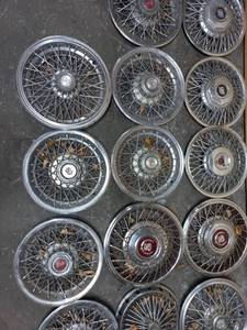 lot 13 image: Collection of 14 Hubcaps