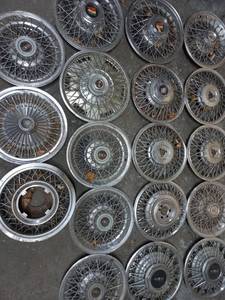 lot 14 image: Collection of 18 Hubcaps