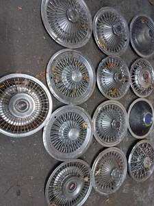 lot 15 image: Collection of 13 Hubcaps