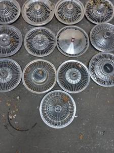lot 16 image: Collection of 13 Hubcaps