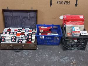 lot 24 image: Milk Crate, Suitcase, and Shopping Basket of Old Car Parts