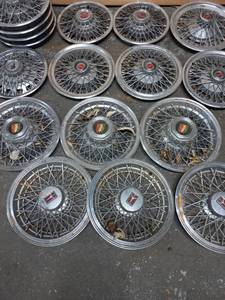 lot 26 image: Collection of 17 Hubcaps