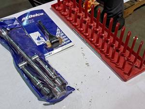 lot 459 image: Lot of (3) Hand Tools - AC Delco 14 Metric Folding Lug Wrench, AC Delco Side Terminal Battery Brush, Hansen Socket Tray,