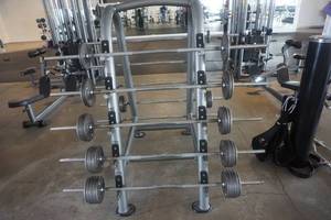 lot 19 image: Matrix Barbell Holder With Barbell Weight Sets