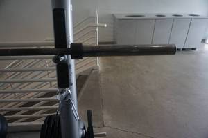 lot 54 image: Olympic Style 45 lb Barbell With 2 Clamps