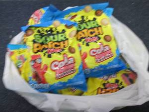 lot 393 image: 12- 8.02 Bags Sour Patch Kids Cola...