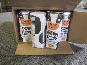 lot 167 image: case of 24 kemps the giving cow red...