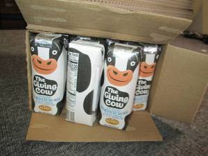 lot 172 image: case of 24 kemps the giving cow red...