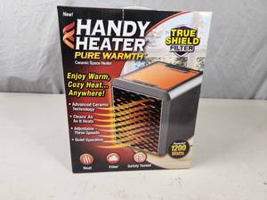 lot 66 image: New Handy Heater Pure Warmth