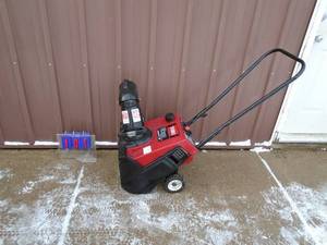 Toro snow thrower with electric start. Used condition. Tested & works. As shown.