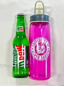 lot 56 image: Vintage UND Fighting Sioux & Mountain Dew Bottles