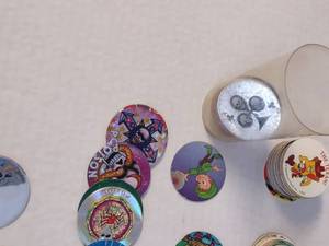 lot 88 image: Tube Full of Random Pogs from All Years