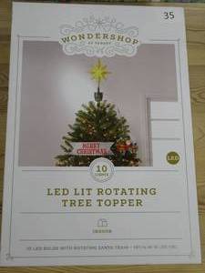 lot 35 image: Wondershop LED Lit Rotating Tree Topper with Santa Train