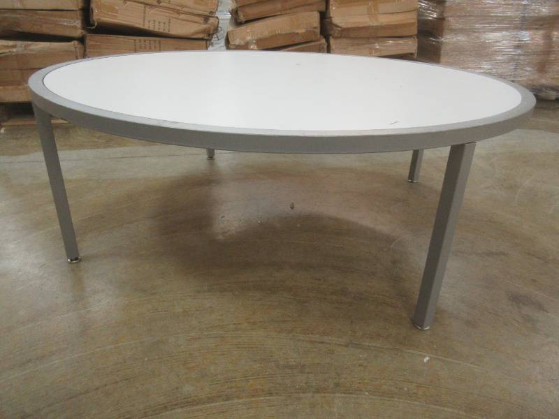 Round Display Table, White Top, Approximate Dimensions 44 Dia x 15 12 Tall. Slight Scratch and Dent.