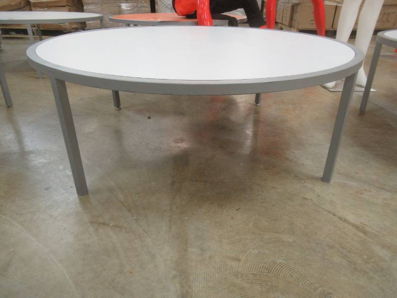 Round Display Table, White Top, Approximate Dimensions 44 Dia x 15 12 Tall. Slight Scratch and Dent.