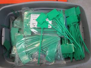 Bin of Green Zip Tie Tags