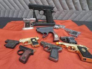 COLLECTION OF GUN LIGHTERS