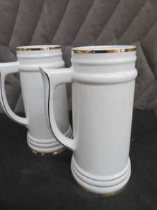 NEW PORCELAIN CASE OF BEER STEINS