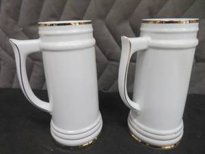 NEW PORCELAIN CASE OF BEER STEINS