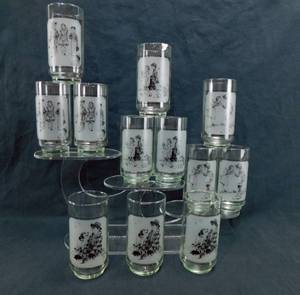 lot 55 image: Lot of 12 Vintage Libbey Norman Rockwell Art High Ball Glasses