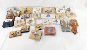 lot 90 image: Lot of 27 Norman Rockwell Inspired Leather Items including Wallets, Coin Purses and Key Holders