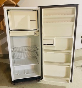 lot 43 image: General Electric RefrigeratorFreezer on a Rolling Cart