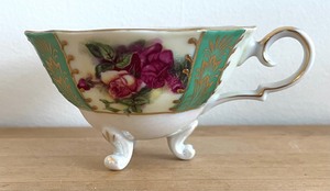 lot 109 image: UCAGCO Hand Painted Teacup with Saucer