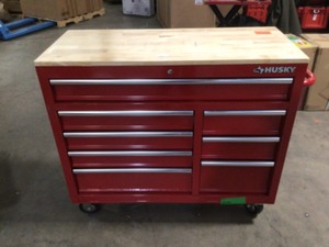 lot 19 image: Husky 42 in. W x 18.1 in. D 8-Drawer Red Mobile Workbench Cabinet with Solid Wood Top, Open Box, Review all pictures