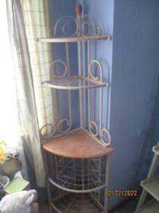 Corner shelf with a solid metal fra...