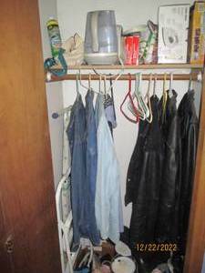 Closet full of clothes and househol...